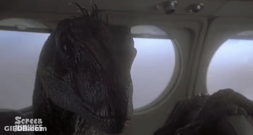 Dinosaur Looking Out Airplane Window GIF