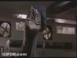 Dinosaur Standing Next To Fan GIF