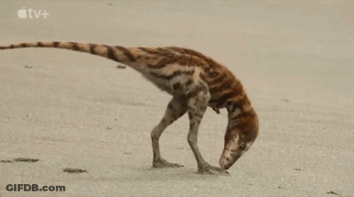 Dinosaur Standing On Hind Legs On Beach GIF