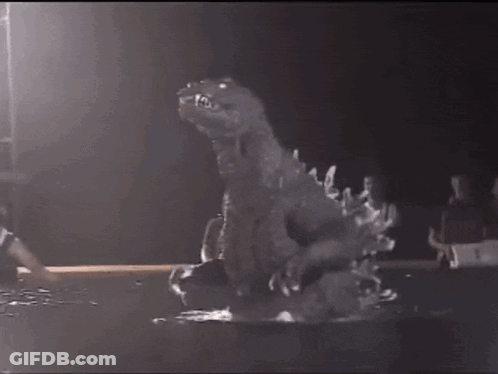 Dinosaur Statue In Dark Room With Basketball Player GIF