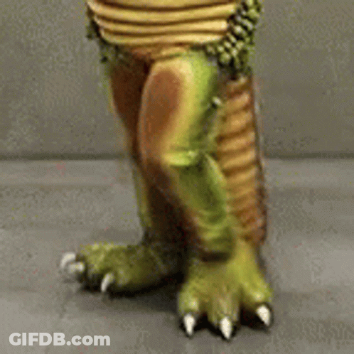 Dinosaur Statue Legs And Feet GIF