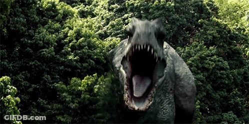 Dinosaur With Mouth Open In Woods GIF