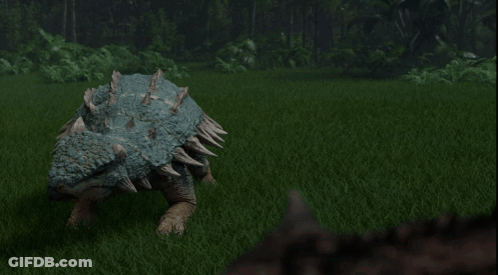 Dinosaur With Spikes On Back In Grassy Field GIF