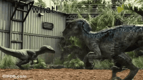 Dinosaurs Standing In Front Of What Building GIF