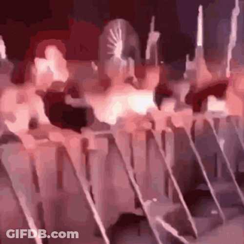Disorderly Mob Attacking Barrier In Mosh Pit GIF