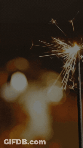 Diwali Greeting Card With Candle And Fireworks GIF