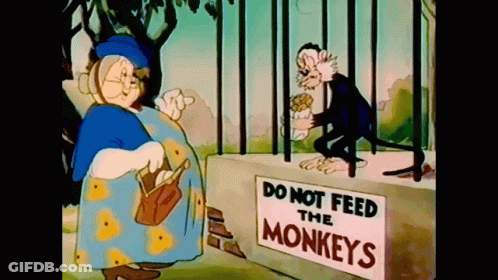 Do Not Feed Monkeys Sign Next To Cartoon Character GIF