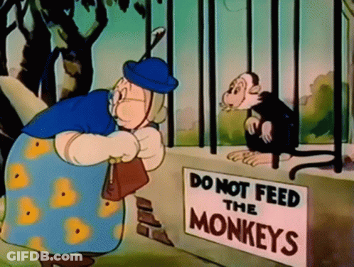 Do Not Feed Monkeys Sign Next To Cartoon GIF