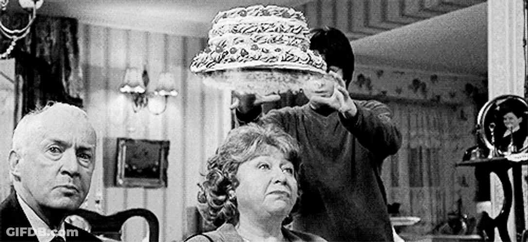 Dobby Performing Magic Placing Cake On Guest GIF