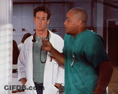 Doctor And Nurse Standing Together GIF