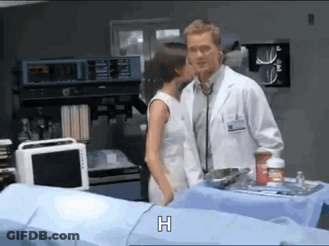 Doctor And Woman Kissing In Hospital Room GIF