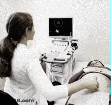 Doctor Examining Pregnant Woman With Ultrasound GIF