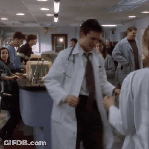 Doctor In Lab Coat Talking To Nurse GIF