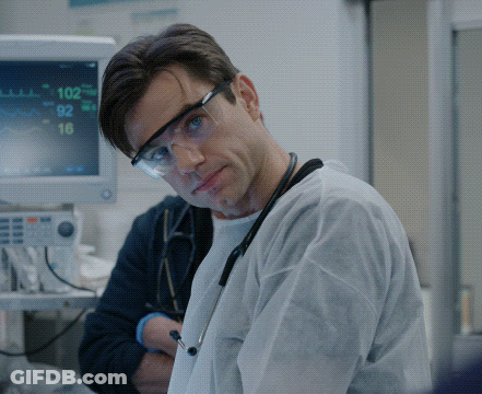 Doctor In Safety Goggles In Front Of Monitor Saying 102 GIF
