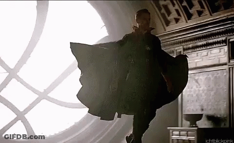 Doctor Strange Is Flying Through The Air In Front Of A Large Window . GIF
