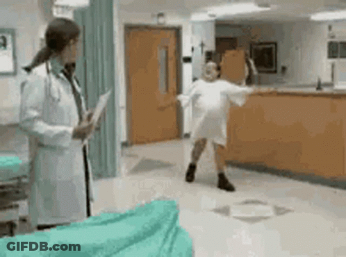 Doctor Talking To Dancing Patient In Hospital GIF