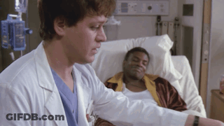 Doctor Talking To Patient In Hospital Bed GIF