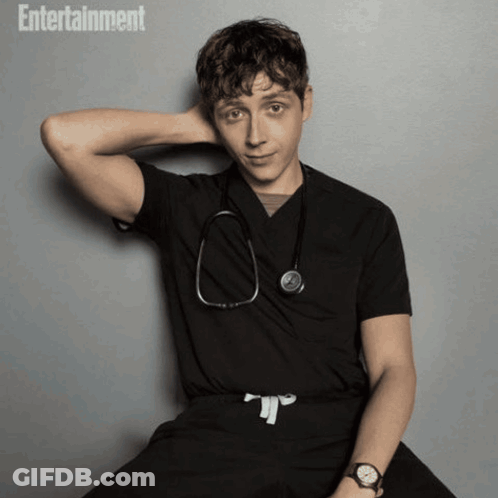 Doctor With Stethoscope In Front Of Poster GIF