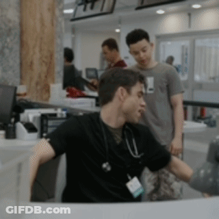 Doctor With Stethoscope Sitting At Desk GIF