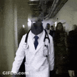 Doctor With Stethoscope Walking Through Hallway GIF