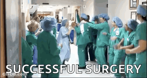 Doctors And Nurses Celebrating Successful Surgery GIF