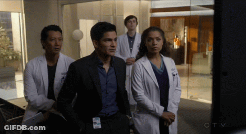 Doctors Standing In Room With CTV Logo GIF