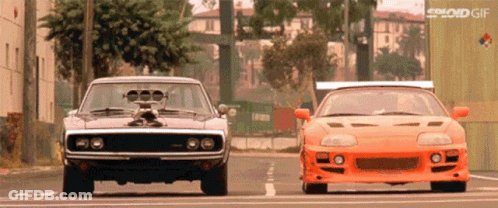 Dodge Charger And Toyota Supra Parked Side By Side GIF