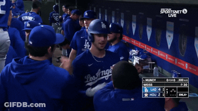 Dodgers Players Huddle In Dugout GIF