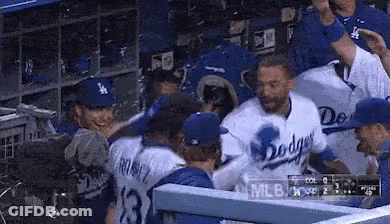 Dodgers Players Sitting In Dugout GIF
