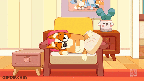 Dog Laying On Chair With ABC Logo GIF