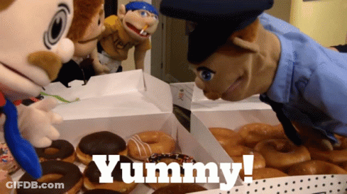 Dog Licking Child's Face In Bed GIF