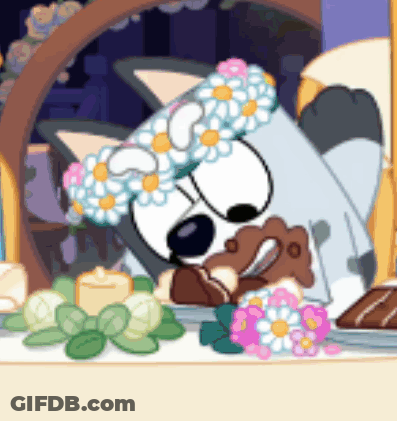 Dog Wearing Flower Crown Lying Down GIF