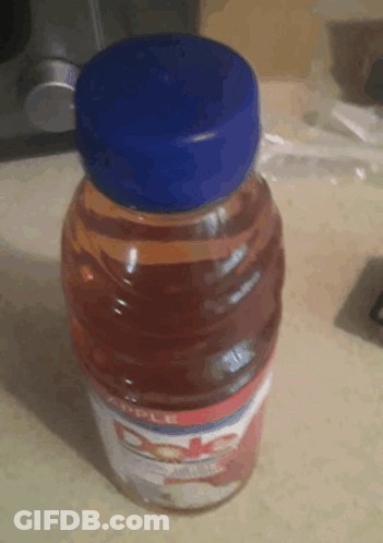 Dole Apple Juice Bottle With Blue Cap GIF
