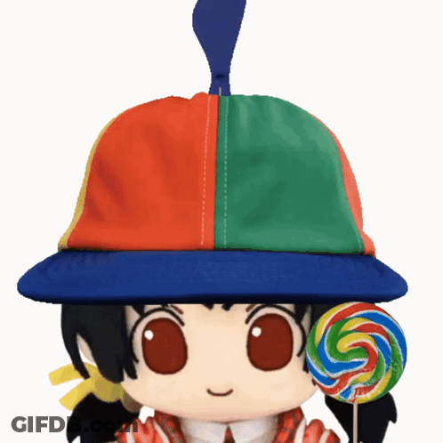 Doll In Colorful Hat Holding Lollipop GIF