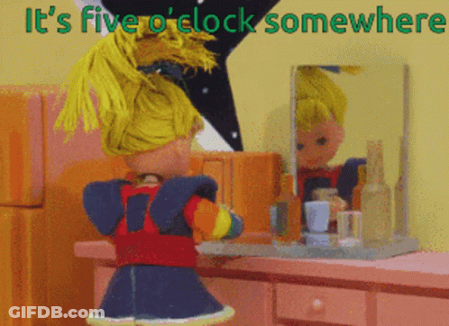 Doll In Front Of Mirror Saying It's Five O'Clock Somewhere GIF