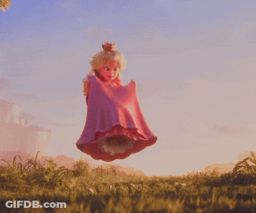 Doll In Pink Dress Jumping In Field GIF