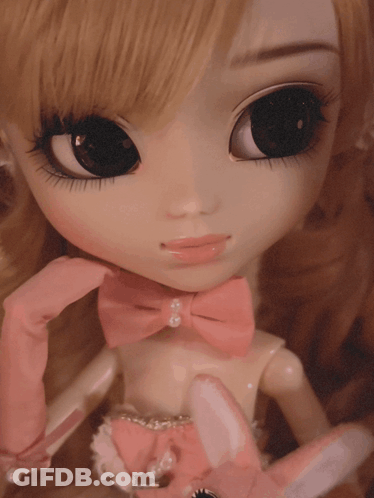 Doll In Pink Gloves And Pink Bow GIF