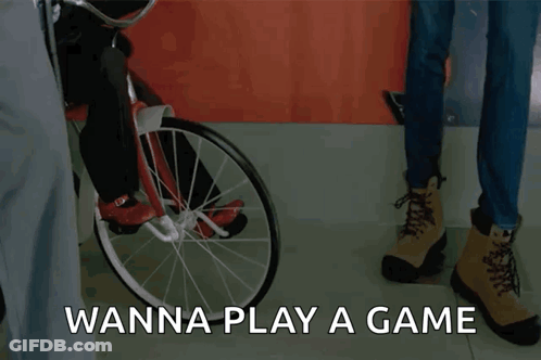 Doll On Tricycle Saying Wanna Play A Game GIF