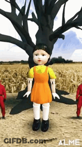 Doll Standing In Field Next To Tree GIF