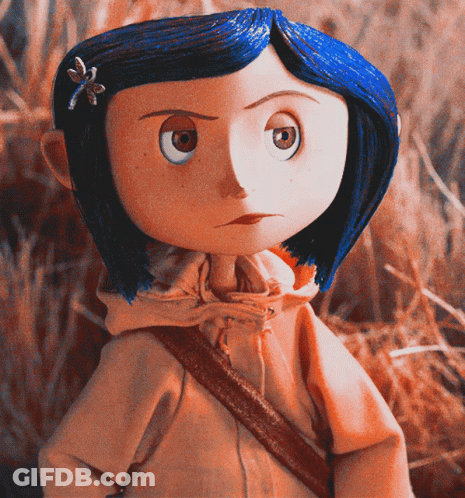 Doll With Blue Hair And Flower Standing In Field GIF