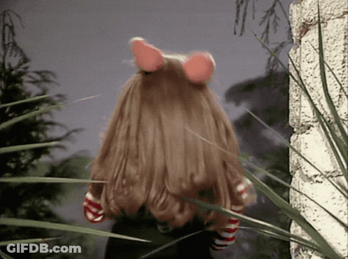 Doll With Long Hair And Pink Ears In Grass GIF