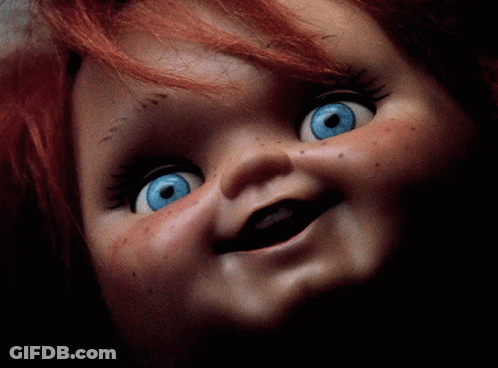 Doll With Red Hair And Blue Eyes Smiling GIF