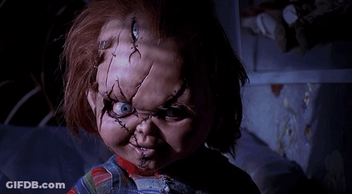 Doll With Stitches On Face In Dark Room GIF