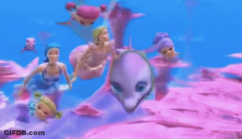 Dolls Swimming In Ocean With Dolphin GIF