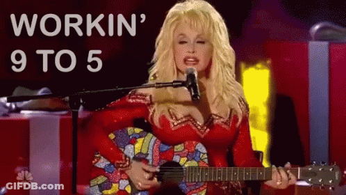 Dolly Parton Is Singing Into A Microphone While Holding A Guitar .. GIF