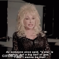 Dolly Parton Is Wearing A Black Lace Dress And Is Talking About A Star . GIF