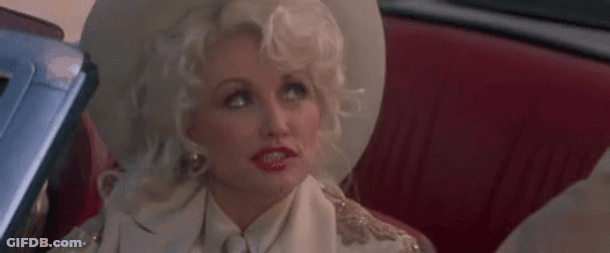 Dolly Parton Looking Up Wink GIF