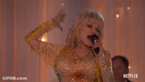 Dolly Parton Singing Into Microphone Netflix Logo GIF