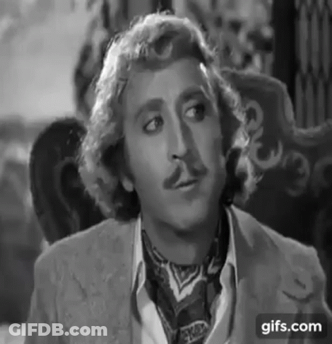 Dolly Parton Singing Into Microphone With Wig And Earrings GIF