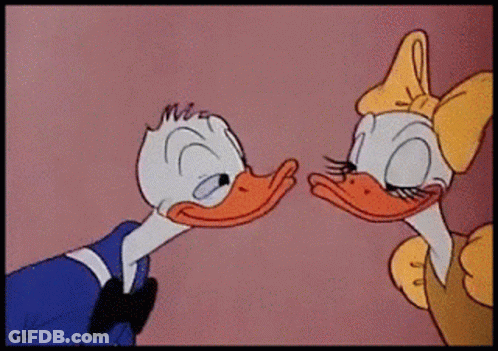 Donald Duck And Daisy Duck Are Kissing Each Other In A Cartoon GIF